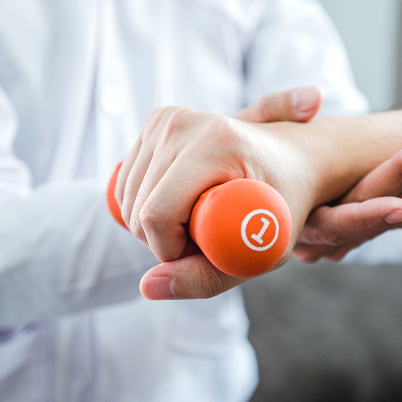 hand-therapy-with-an-orange-dumbbell-weight-2026-03-17-08-58-40-utcV_hand_